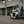 Two riders on Zero LS1 scooters outside an industrial building