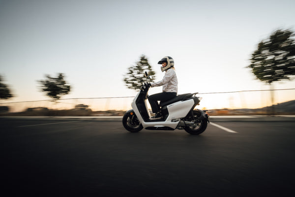 Rider on a white Zero LS1 in evening light